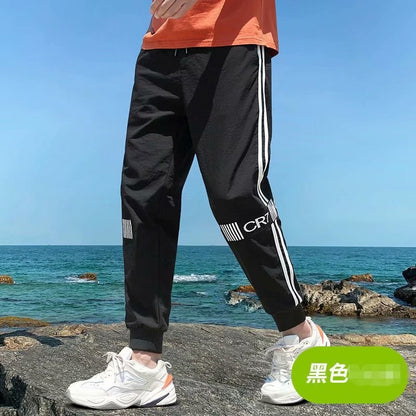 2021 casual pants men's Korean version of loose casual trend rod strips fashion small feet young people nine pants